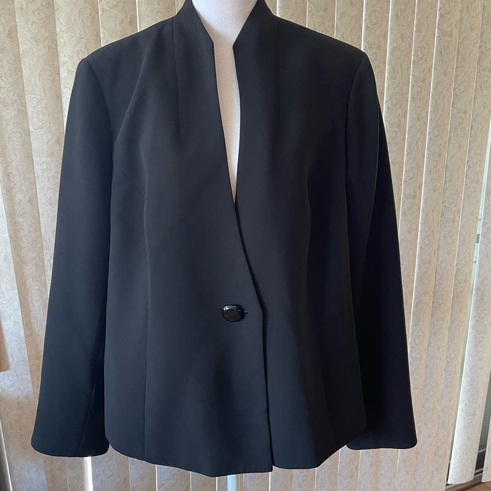 Collarless Classic Black Blazer with Single Button on front.  Notched Sleeves